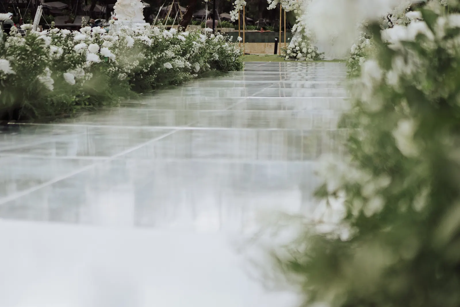 Mirror dance floor reflecting the sky, white floral border running its full length