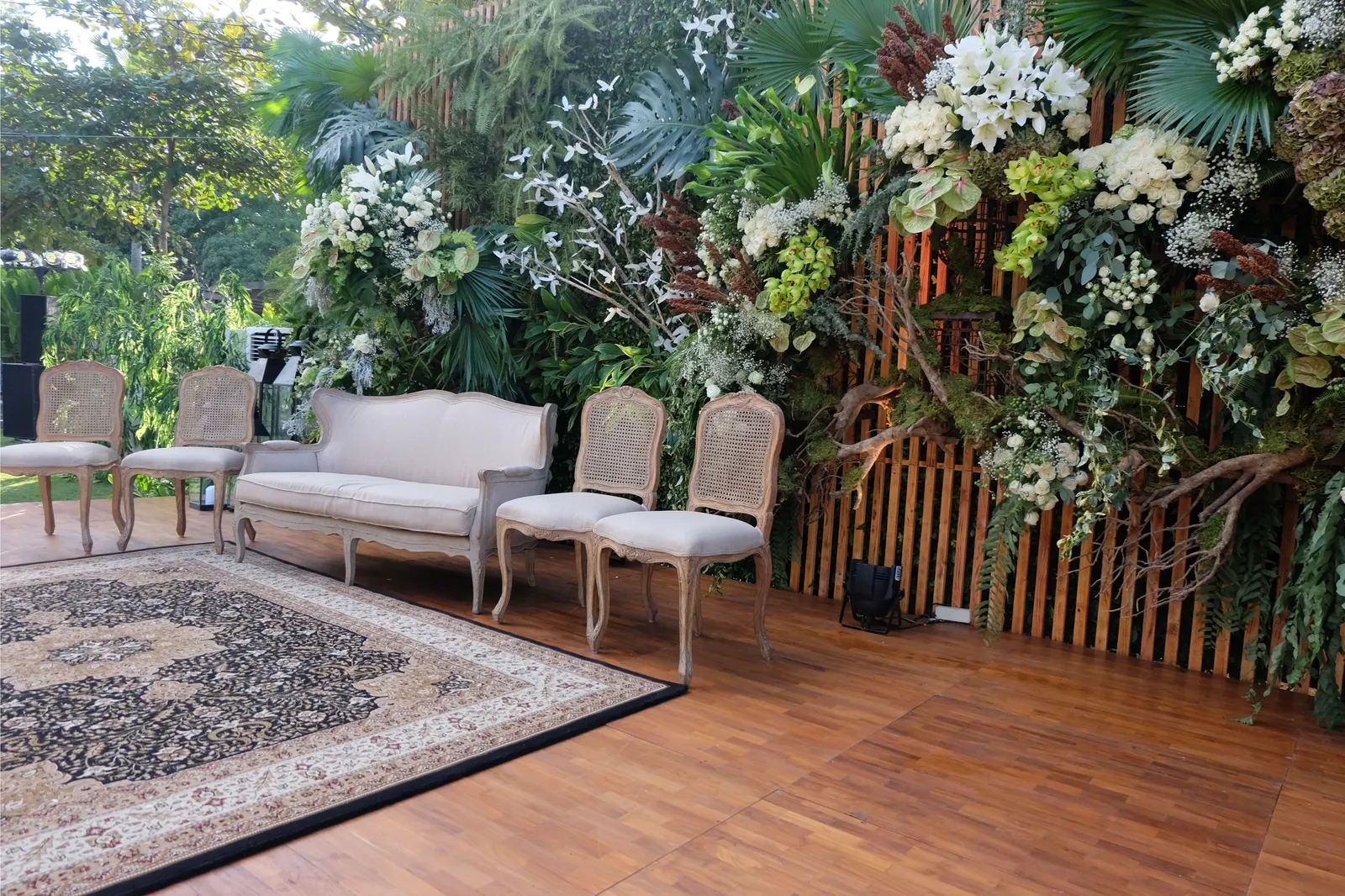Timber stage with sofas and a rug set for the head table